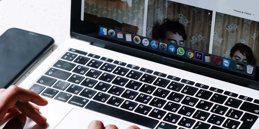 A person sitting at a café, looking thoughtfully at their laptop while sipping coffee. The screen shows an email interface with an eye-catching subject line. The ambiance of the café adds a relaxed yet focused vibe to the act of reaching out.