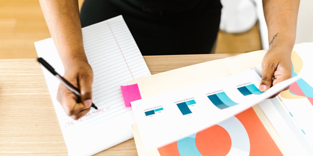 A close-up of a printed guest post template with handwritten notes and edits in the margins. The template is placed on a wooden table, with a vintage typewriter and a steaming cup of tea nearby, evoking a sense of nostalgia and creativity.