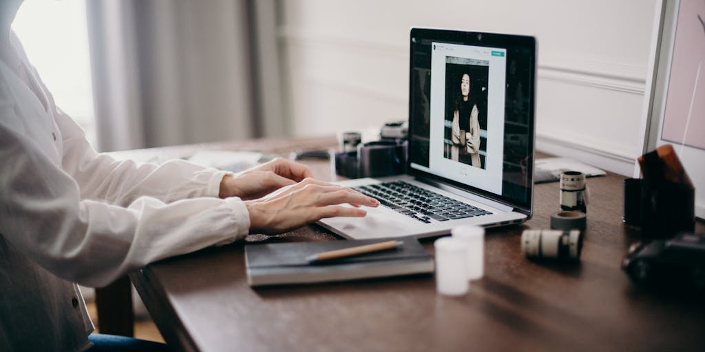 A split-screen image showing a person using a laptop on one side, with a vibrant, colorful interface of Instantly.ai on the screen, and on the other side, a close-up of their focused face, highlighting the ease and excitement of using the platform.