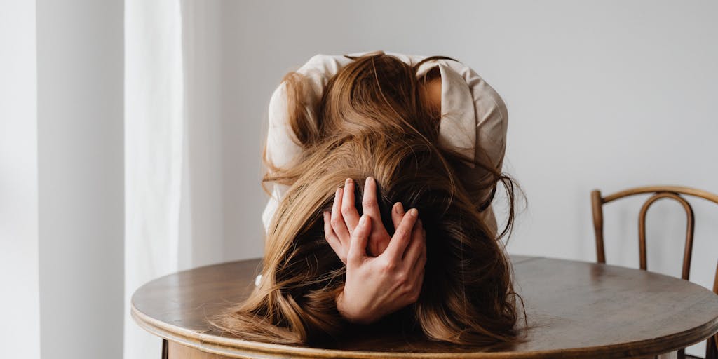 A split image showing two contrasting scenes: one side depicts a person looking stressed with bills and expenses, while the other side shows the same person relaxed and happy after discovering Mailshake's affordable pricing. This visual contrast emphasizes the value of the service.