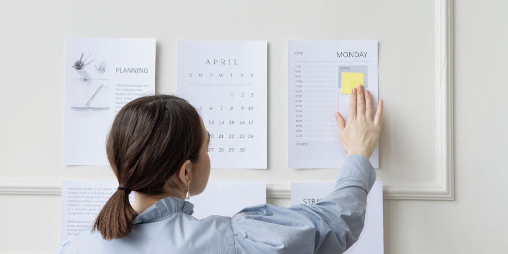 A dynamic image of a team in a meeting room discussing Klenty pricing strategies, with a whiteboard filled with charts and notes in the background. The team members are engaged and animated, showcasing collaboration and innovation.