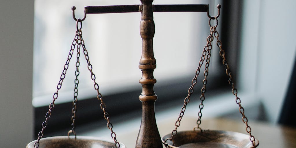 A conceptual image of a scale balancing two objects: one representing high pricing (like a gold bar) and the other representing Amplemarket's competitive pricing (like a stack of coins). The background is a soft gradient to emphasize the balance and decision-making aspect.