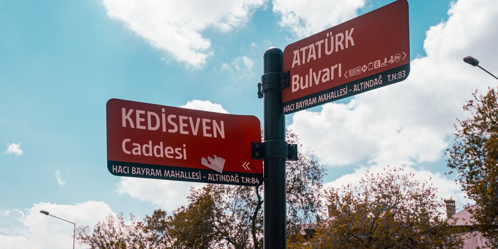 A conceptual image of a person standing at a crossroads with multiple signposts labeled with different pricing strategies. The background features a city skyline, symbolizing the choices businesses face in pricing their products in a competitive market.