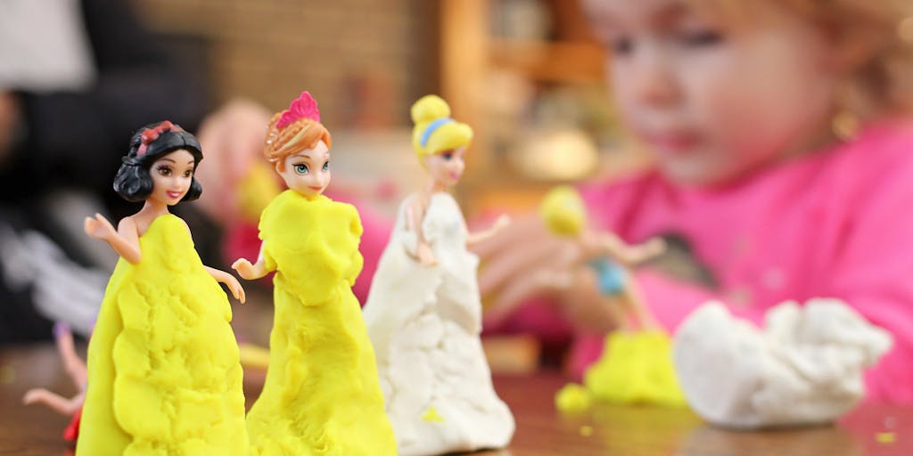 A whimsical scene featuring clay figurines representing different pricing tiers (e.g., a small figure for basic, a medium figure for standard, and a large figure for premium) arranged on a colorful background. Each figure is uniquely styled to reflect its pricing level.