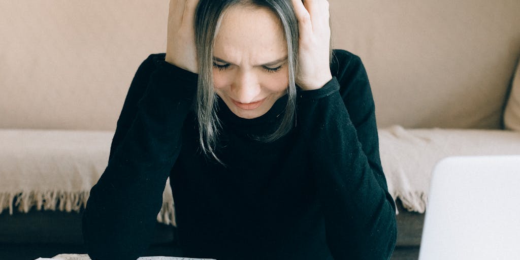 A split image showing two contrasting scenarios: one side depicts a person looking stressed with bills and expenses, while the other side shows a relaxed individual using Leadfuze on a laptop with a smile. This juxtaposition illustrates the benefits of using Leadfuze for pricing and lead generation.