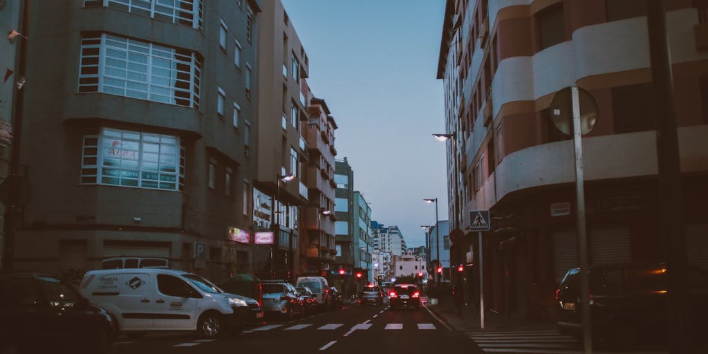 A whimsical scene depicting a canary delivering letters with price tags attached to them. The canary is in mid-flight, with a blurred background of a city skyline, representing the speed and efficiency of Canary Mail. The letters are colorful and feature different pricing options, creating a dynamic and engaging visual.