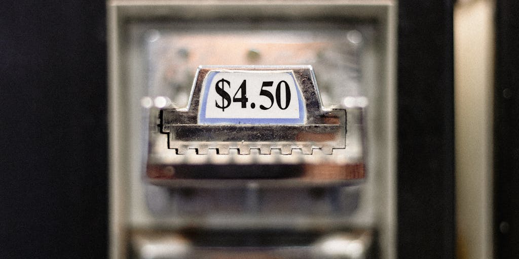 A close-up shot of a vintage scale balancing gold coins on one side and a modern digital pricing tag on the other, symbolizing the balance between traditional and modern pricing strategies in Apollo Leads.