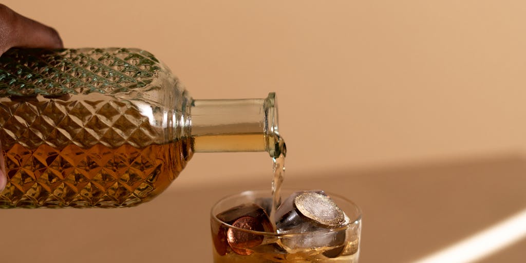A close-up shot of a crystal ball resting on a stack of coins, symbolizing the idea of pricing insights and financial clarity. The background is softly blurred to emphasize the crystal ball, which reflects a vibrant city skyline, representing the potential growth and opportunities in pricing strategies.