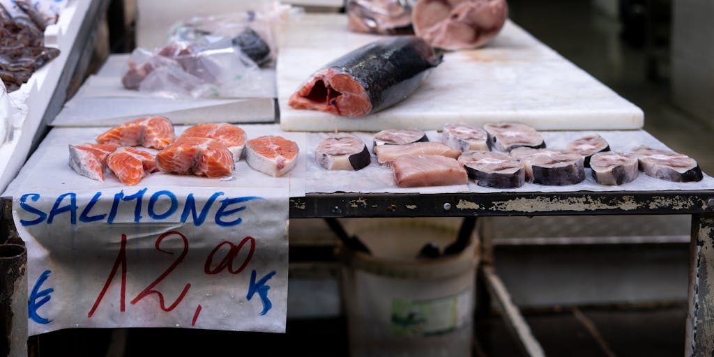 A conceptual photo of two hands coming together, each holding a different price tag. One tag is colorful and vibrant, representing a sale, while the other is more subdued, representing regular pricing. The hands are positioned in a way that suggests they are merging the two prices into one, symbolizing the idea of merge pricing.