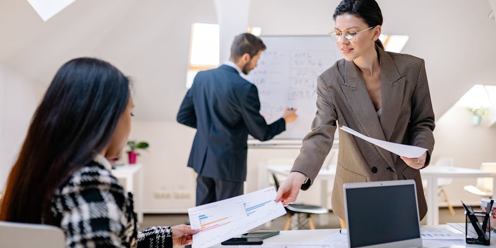 A person standing in front of a whiteboard filled with colorful mind maps and keywords related to networking and communication strategies. The focus is on a section dedicated to 'Best InMail Subject Lines', showcasing a dynamic and collaborative environment.
