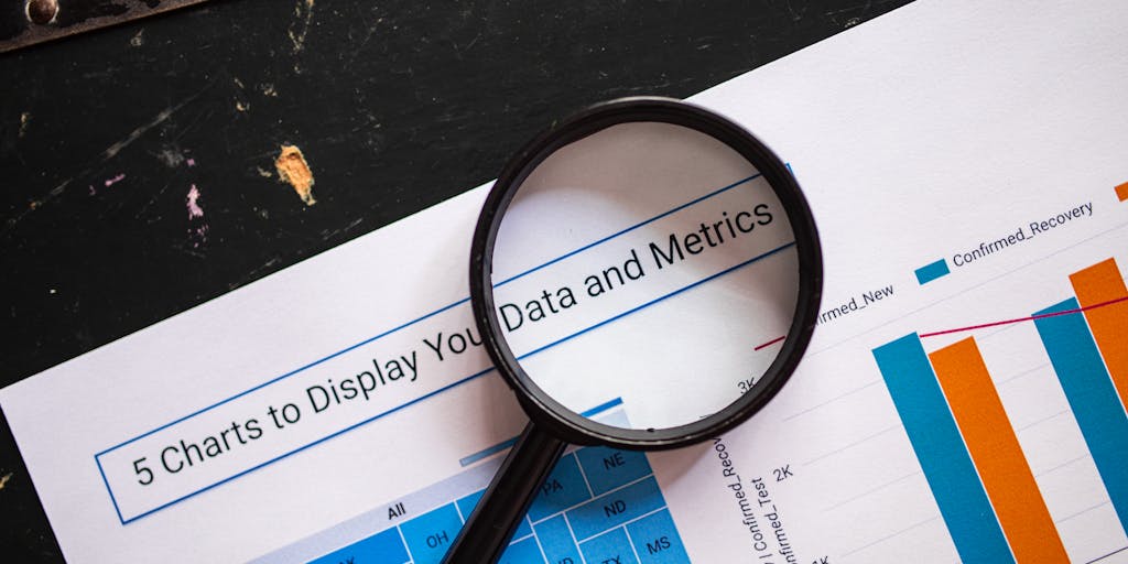 An abstract image of a magnifying glass hovering over a digital map filled with various data points and icons, representing the process of uncovering insights through data enrichment. The colors are vibrant, emphasizing the importance of data exploration.