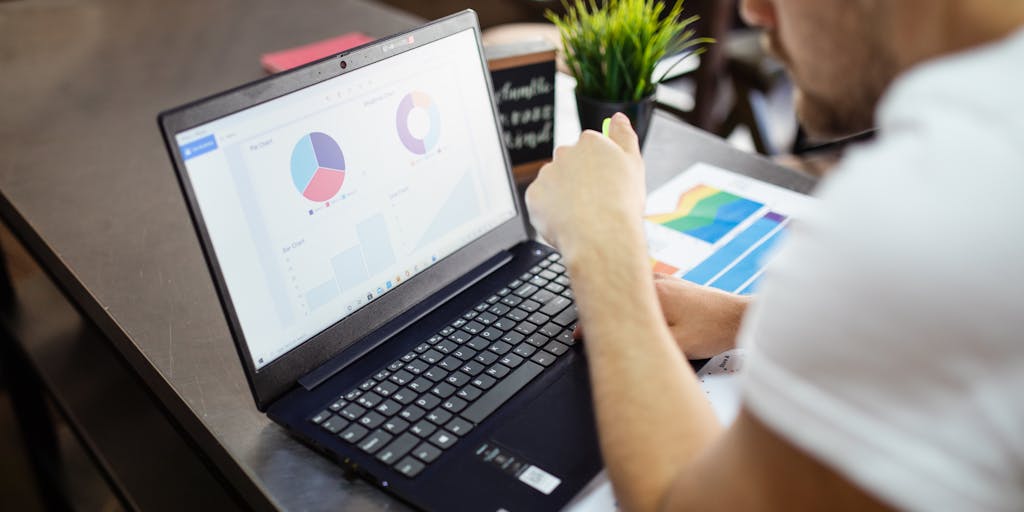 A split-screen image showing a person on one side using a laptop with LinkedIn open, and on the other side, a visual representation of data analytics, such as graphs and charts. This juxtaposition highlights the analytical aspect of X-Ray searching for candidates.