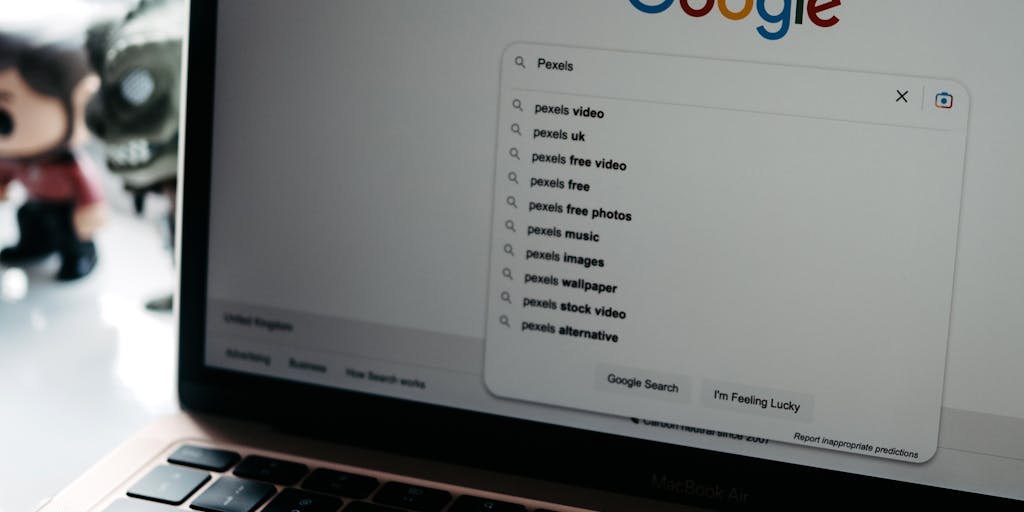 A close-up shot of a laptop screen displaying a LinkedIn search results page, with a hand hovering over the keyboard ready to export the data. The background is softly blurred to emphasize the screen, and a coffee cup sits nearby, suggesting a productive work environment.