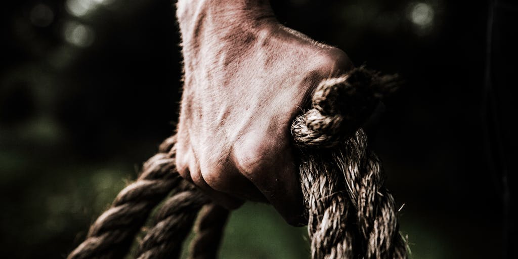 A conceptual image of a tug-of-war between two teams, one representing ZoomInfo and the other LinkedIn Sales Navigator. Each team should be pulling on a rope that symbolizes 'Sales Leads', with expressions of determination. The background can be a blurred office environment to keep the focus on the teams.