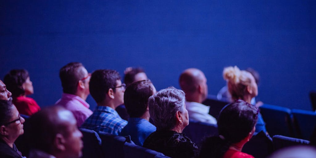 A split-screen image showing two scenarios: on one side, a person posting a question in a LinkedIn Group, and on the other, a group of professionals actively discussing and responding. This visual emphasizes the importance of interaction and engagement within groups.