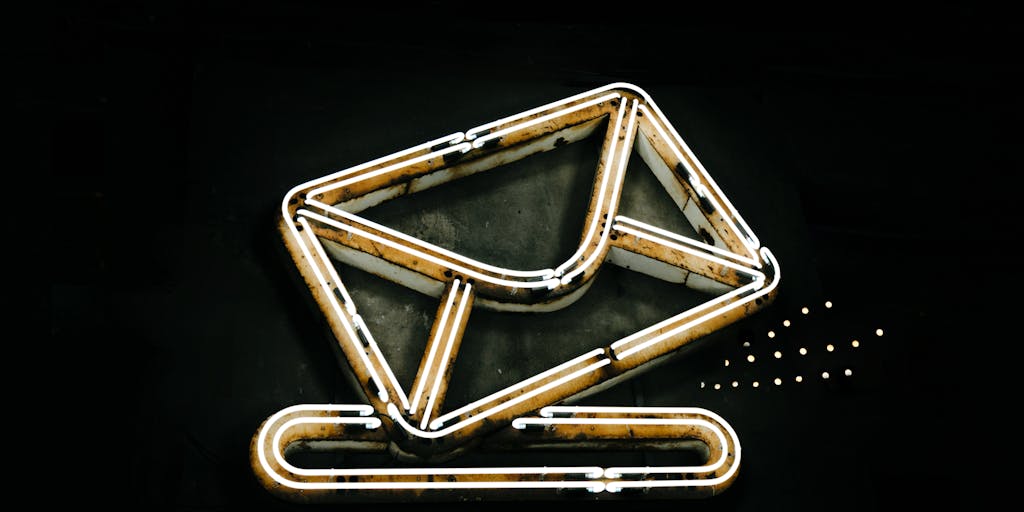 An artistic representation of an email envelope and a LinkedIn logo, both floating in a digital space. The email envelope is depicted with traditional paper textures, while the LinkedIn logo is sleek and modern. Surrounding them are digital elements like binary code and social media icons to emphasize the digital communication theme.